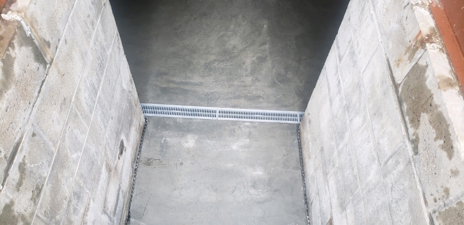 poured concrete and drain system installation